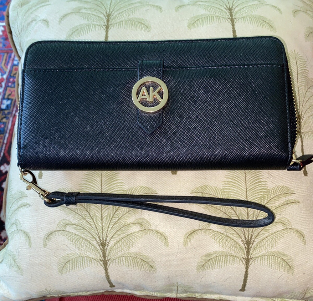 Anna Klein wallet zip around black with gold colored zippers and emblem wristlet